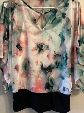 Jennifer Lopez pastel floral top with black ruched bottom.